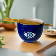 Stylish 18 oz Evil Eye Ceramic Ramen Bowl with Chopsticks, made of food-safe ceramic, available in striking Blue or pristine White, beautifully packaged in a gift box, perfect for an ideal present.