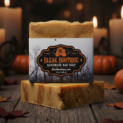Handmade bar soap from Bleak Boutique with pumpkins and candles in the background