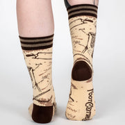 Vintage anatomy design socks with black and brown accents on a white background