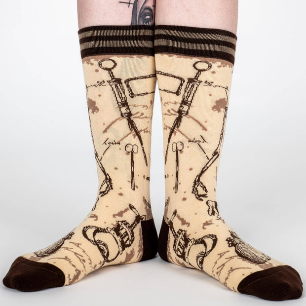 Socks with skeleton design on a plain background