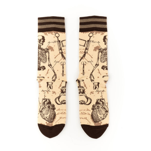 Socks with skeleton and heart design on a beige background