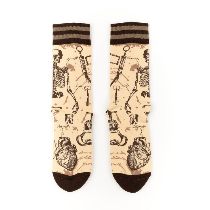 Socks with skeleton and heart design on a beige background