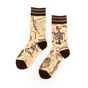 Socks with skeleton design on a beige background