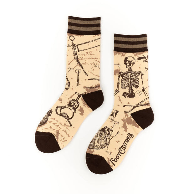 Socks with skeleton design on a beige background