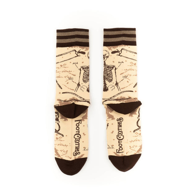 Pair of socks with vintage-style design and brand logo on a white background