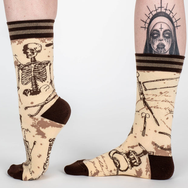 Socks with skeleton design on a plain background