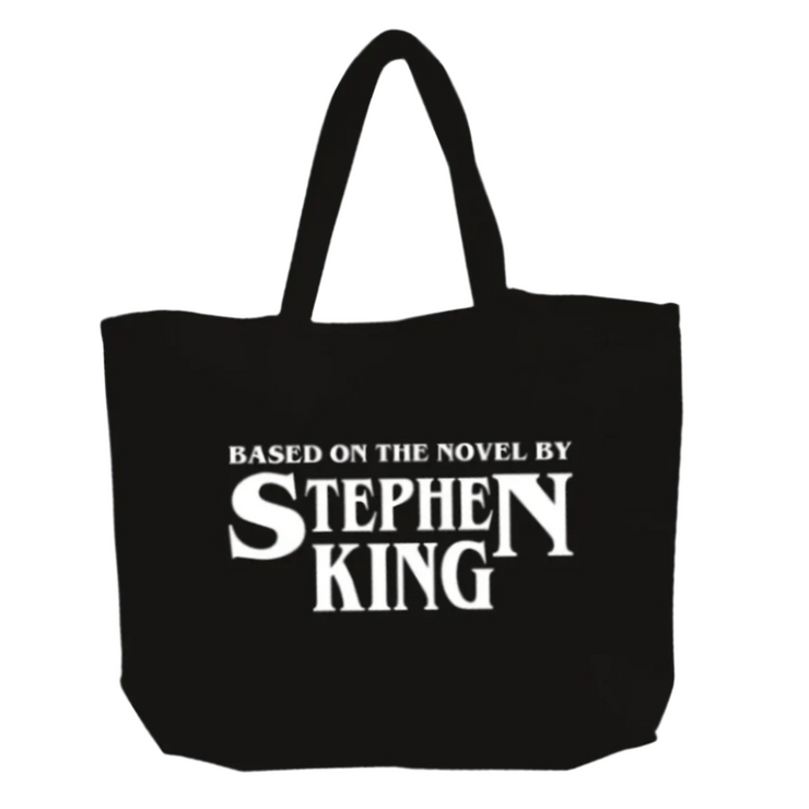 Black tote bag with 'Based on the Novel by Stephen King' text on a white background