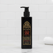 Black bottle of Bleak Boutique liquid soap on a white background