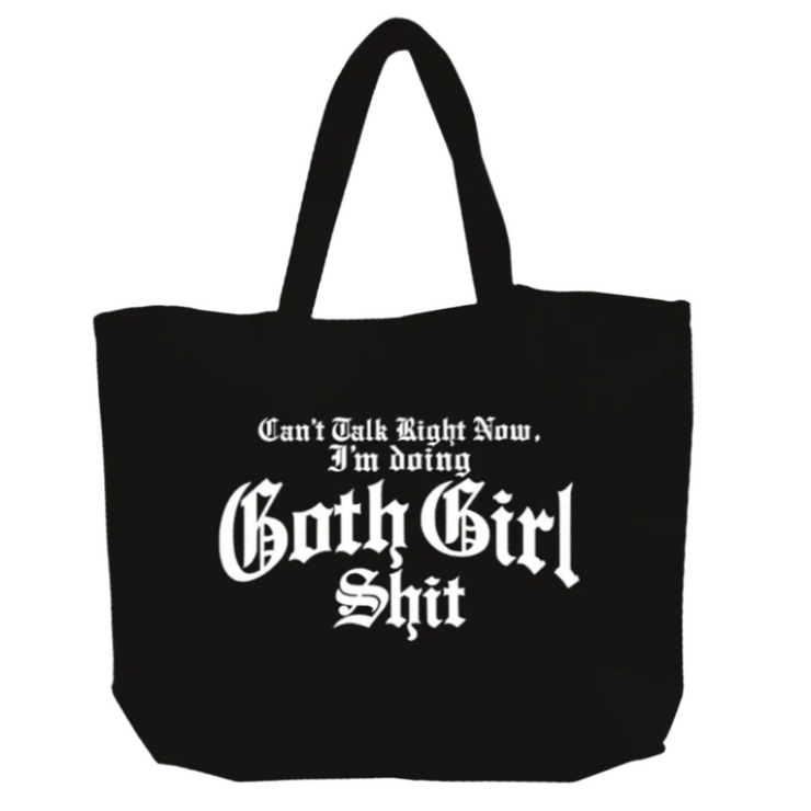 Black tote bag with white text on a white background