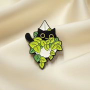 Pin with green leaf design on a light gray background