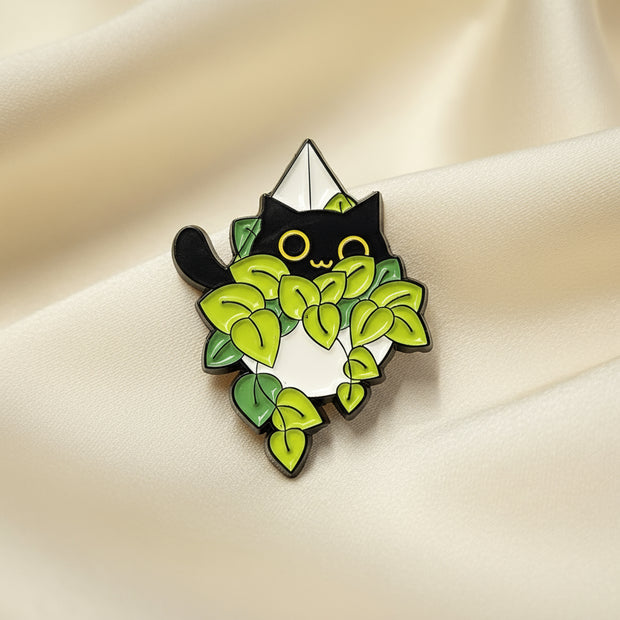 Pin with green leaf design on a light gray background