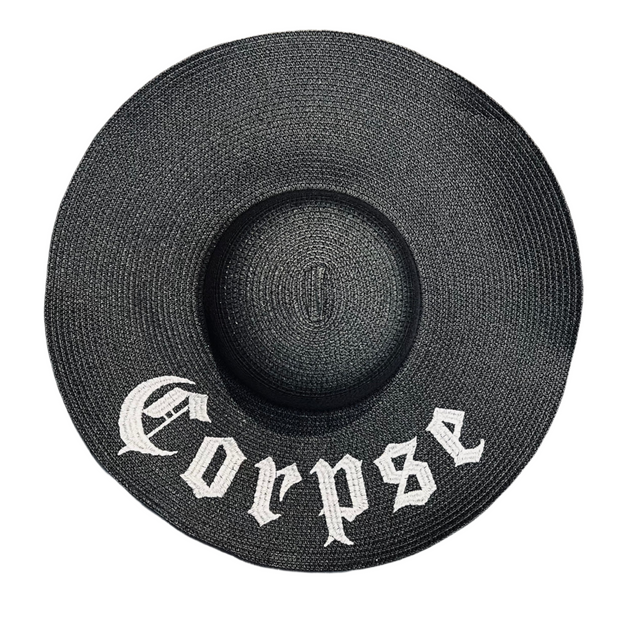 Black straw hat with 'Corpse' embroidery on a white background