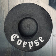 Black straw hat with 'Corpse' embroidery.