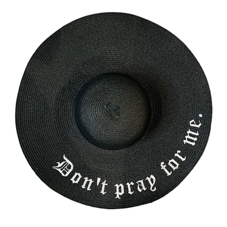 Black straw hat with 'Don't pray for me.' text on a white background
