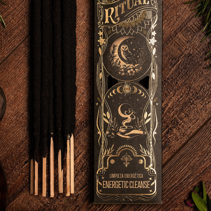 Incense sticks with decorative packaging on a wooden surface