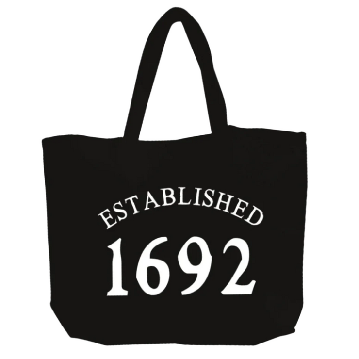 Black tote bag with 'Established 1692' text on a white background