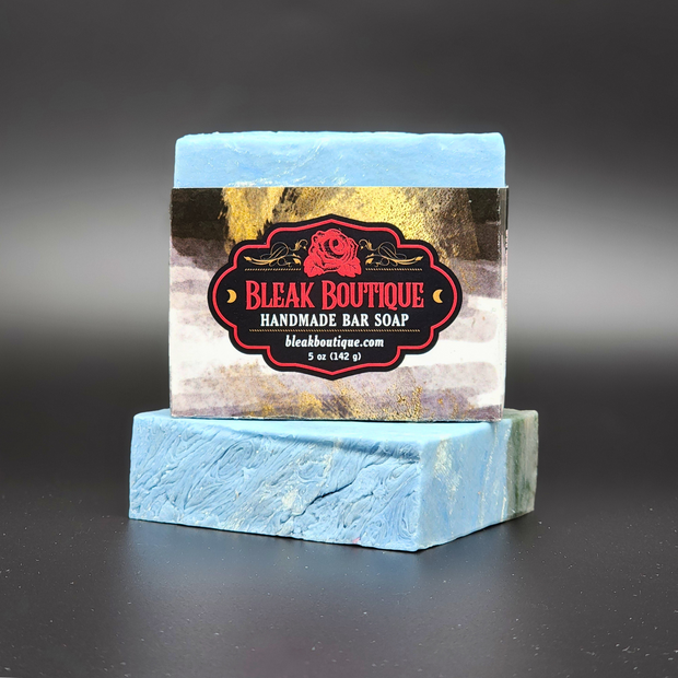 Handmade bar soap with Bleak Boutique label on a dark background