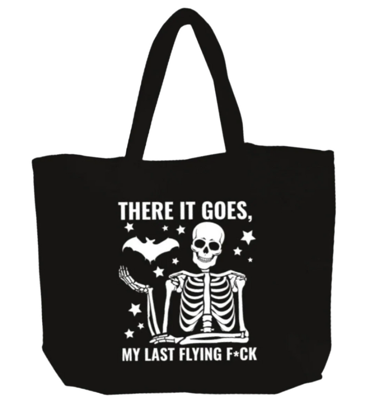 Black tote bag with a skeleton and text design on a white background