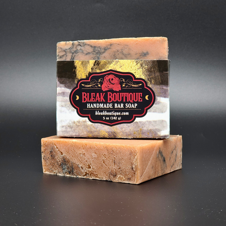 Handmade bar soap with Bleak Boutique label on a dark background
