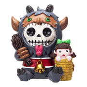 Toy figure of horned Krampus with a skeleton face, holding a child in a basket on a white background