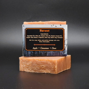 Bar of soap with a label on a dark background