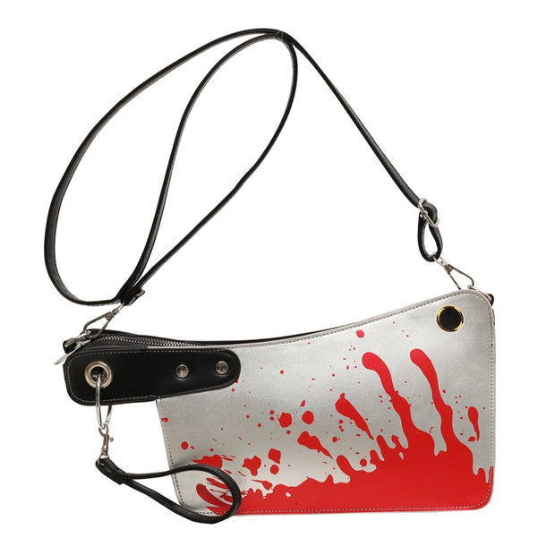 Handbag with red and white splatter design on a white background