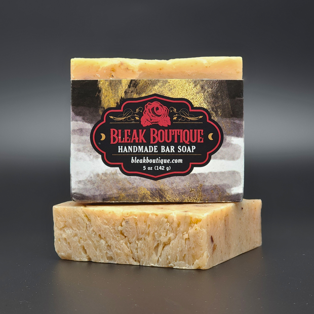 Handmade bar soap with Bleak Boutique label on a dark background