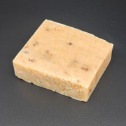 Bar of square soap on a dark background