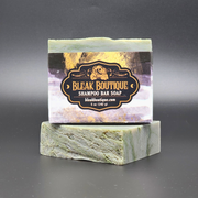 Shampoo bar soap with Bleak Boutique label on a gray background
