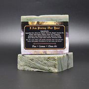 Bar of soap on a green marble stand with a label on a black background