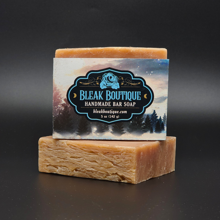 Handmade bar soap with Bleak Boutique label on a dark background