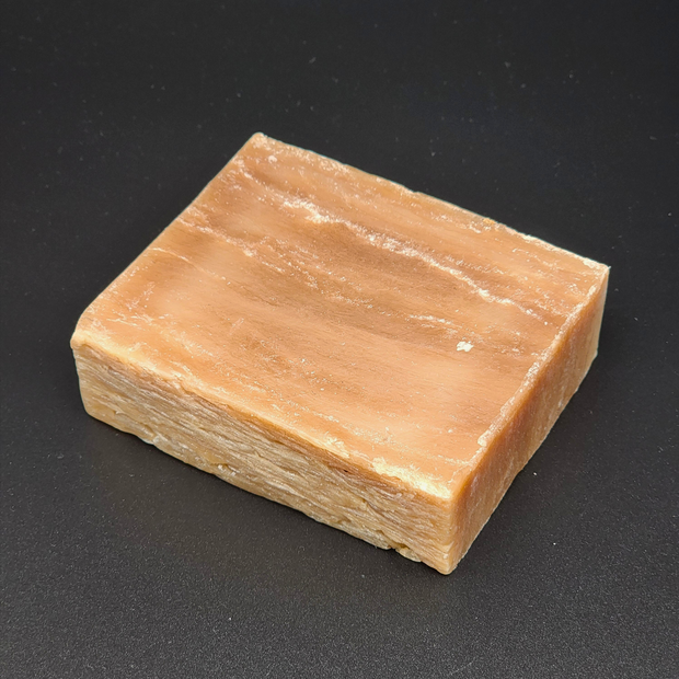 Block of soap on a black background