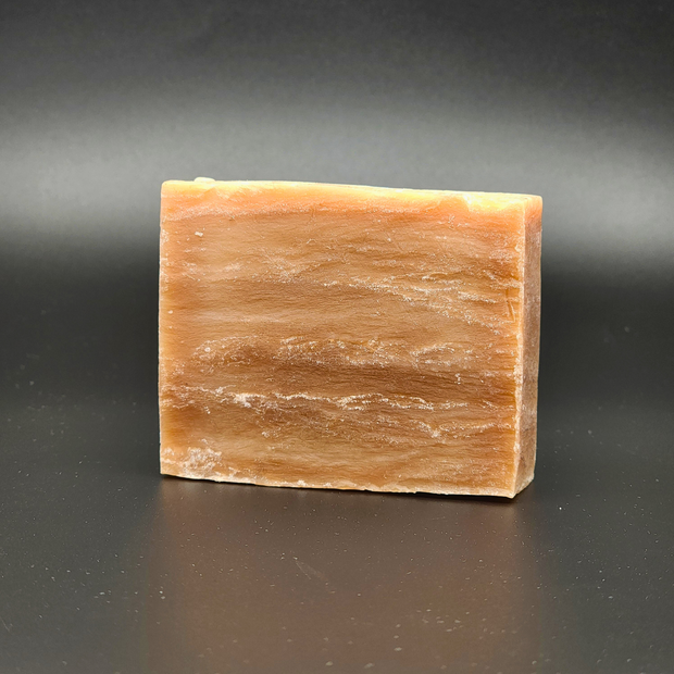 Bar of soap on a dark gray background