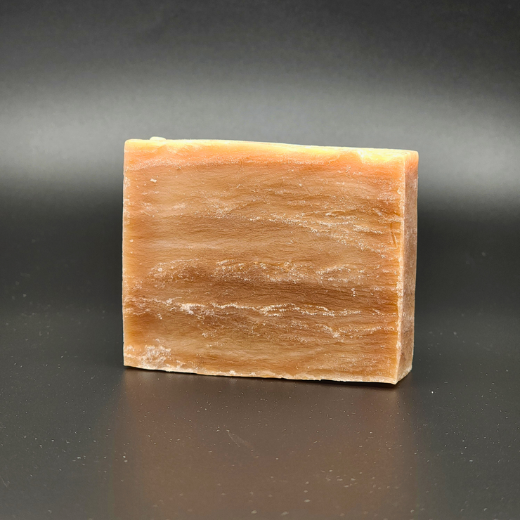 Bar of soap on a dark gray background