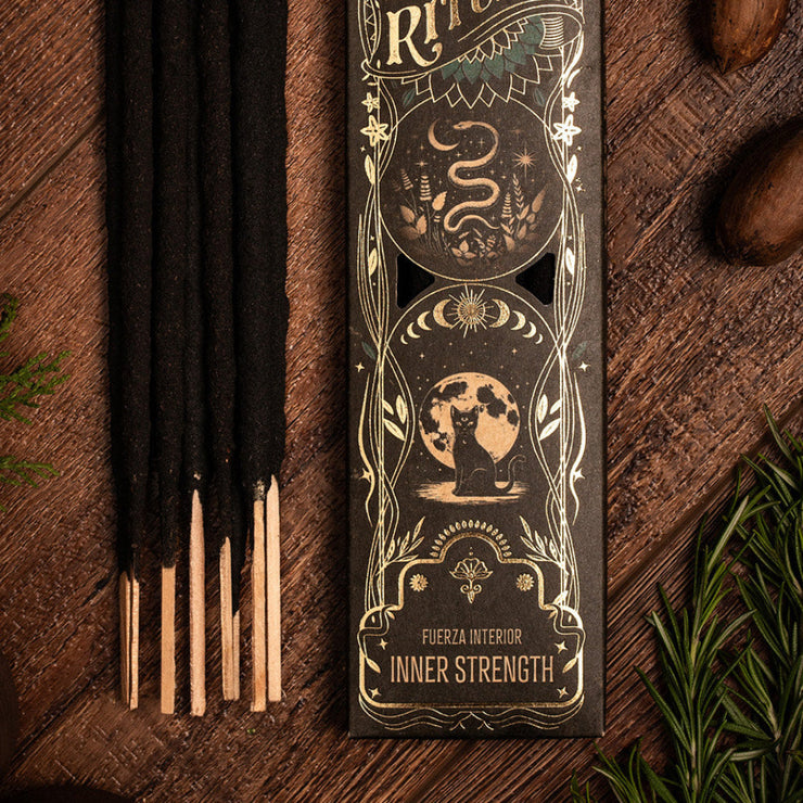 Incense sticks with decorative packaging on a wooden surface