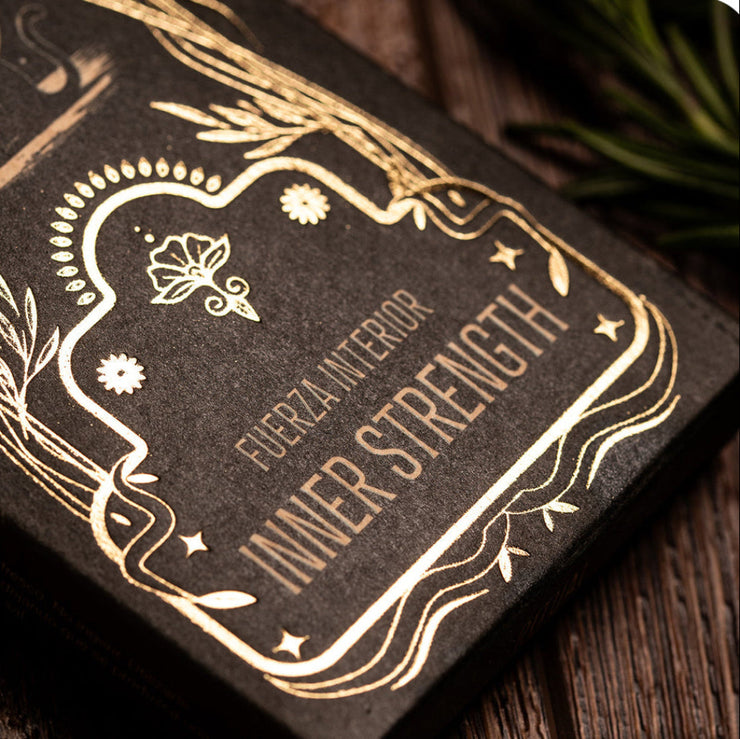 Decorative packaging with 'Inner Strength' text on a wooden surface