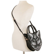 Black handbag with cat design on a mannequin against a white background