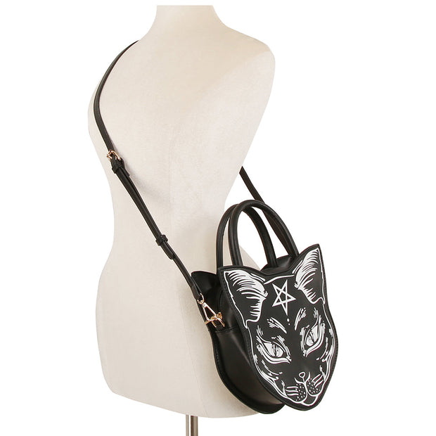 Black handbag with cat design on a mannequin against a white background