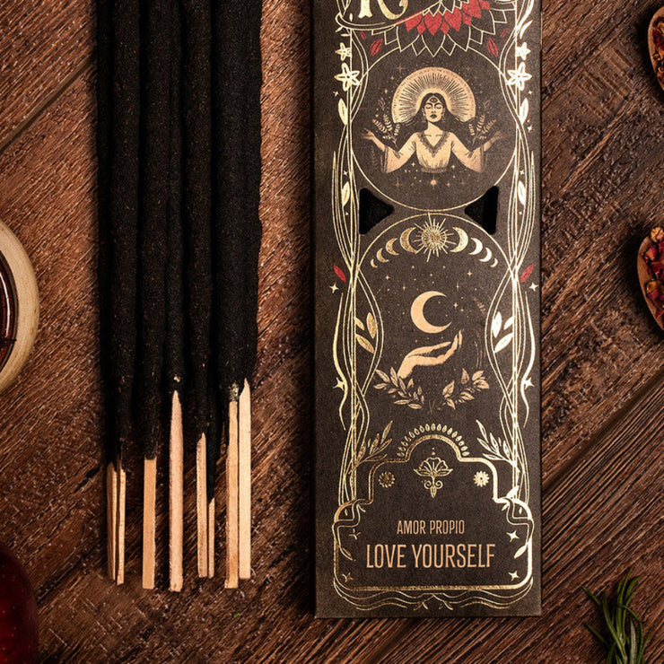 Incense sticks with decorative packaging on a wooden surface