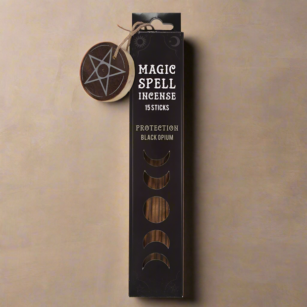 Box of Magic Spell Incense with a pentagram tag on a beige background