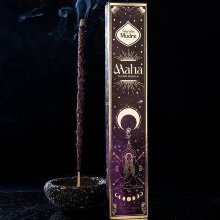 Maha incense stick with packaging against a dark background