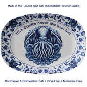 Oval platter with blue Cthulhu design and text on a white background