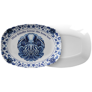 Decorative plate with Cthulhu design and text on a white background