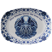Decorative plate with blue Cthulhu design and text on a white background