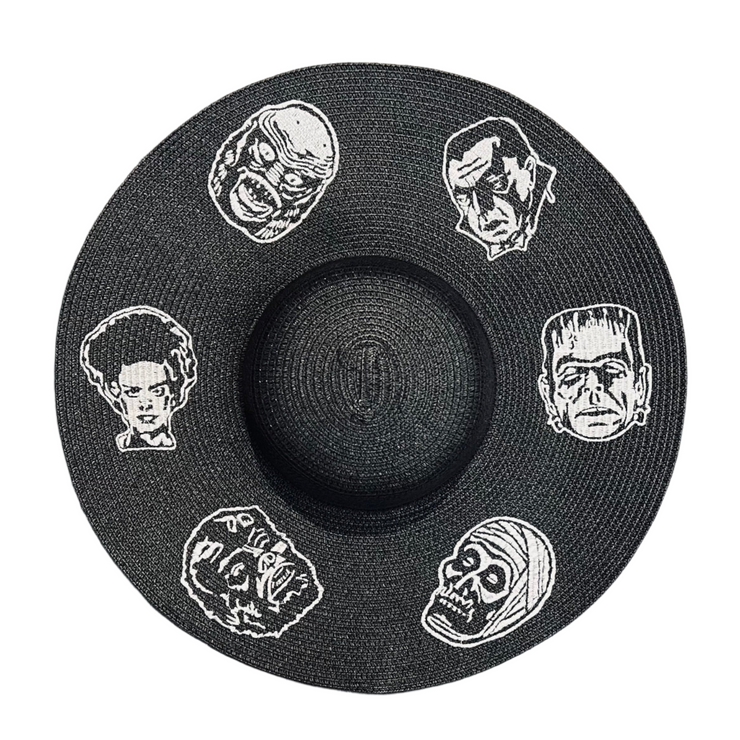 Black straw hat with white embroidered classic horror movie monster faces on a white background