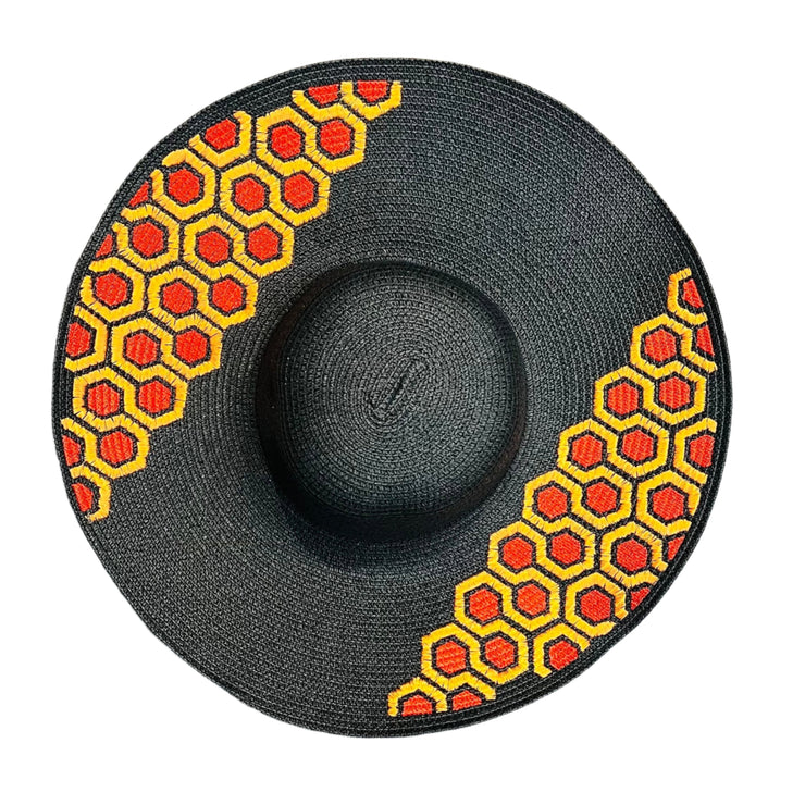 Black hat with red and yellow geometric pattern on a white background