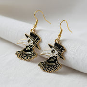 Plague Doctor Gold Enamel Earrings on a white background