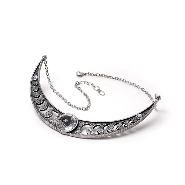 Silver necklace with crescent moon design on a white background