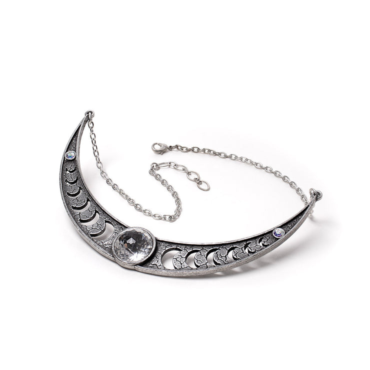 Silver necklace with crescent moon design on a white background