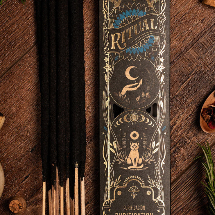 Incense sticks with decorative packaging on a wooden surface